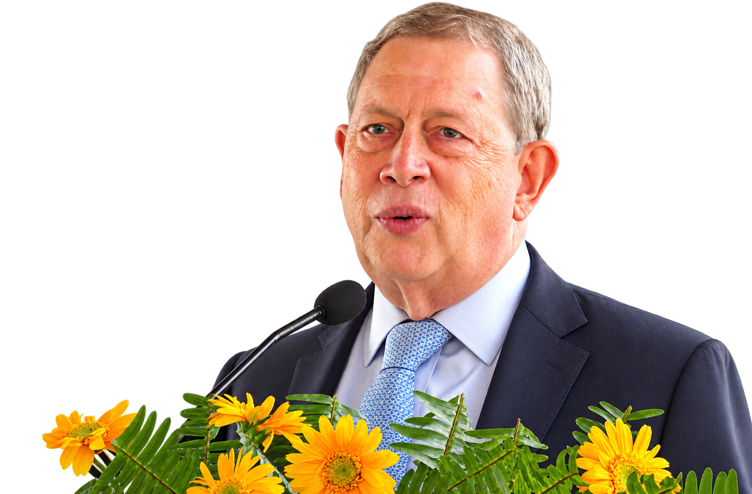 John C. Martin speaking at a microphone